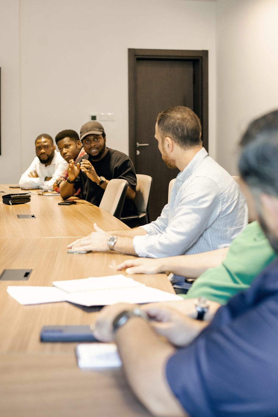 Team meeting around a long boardroom table